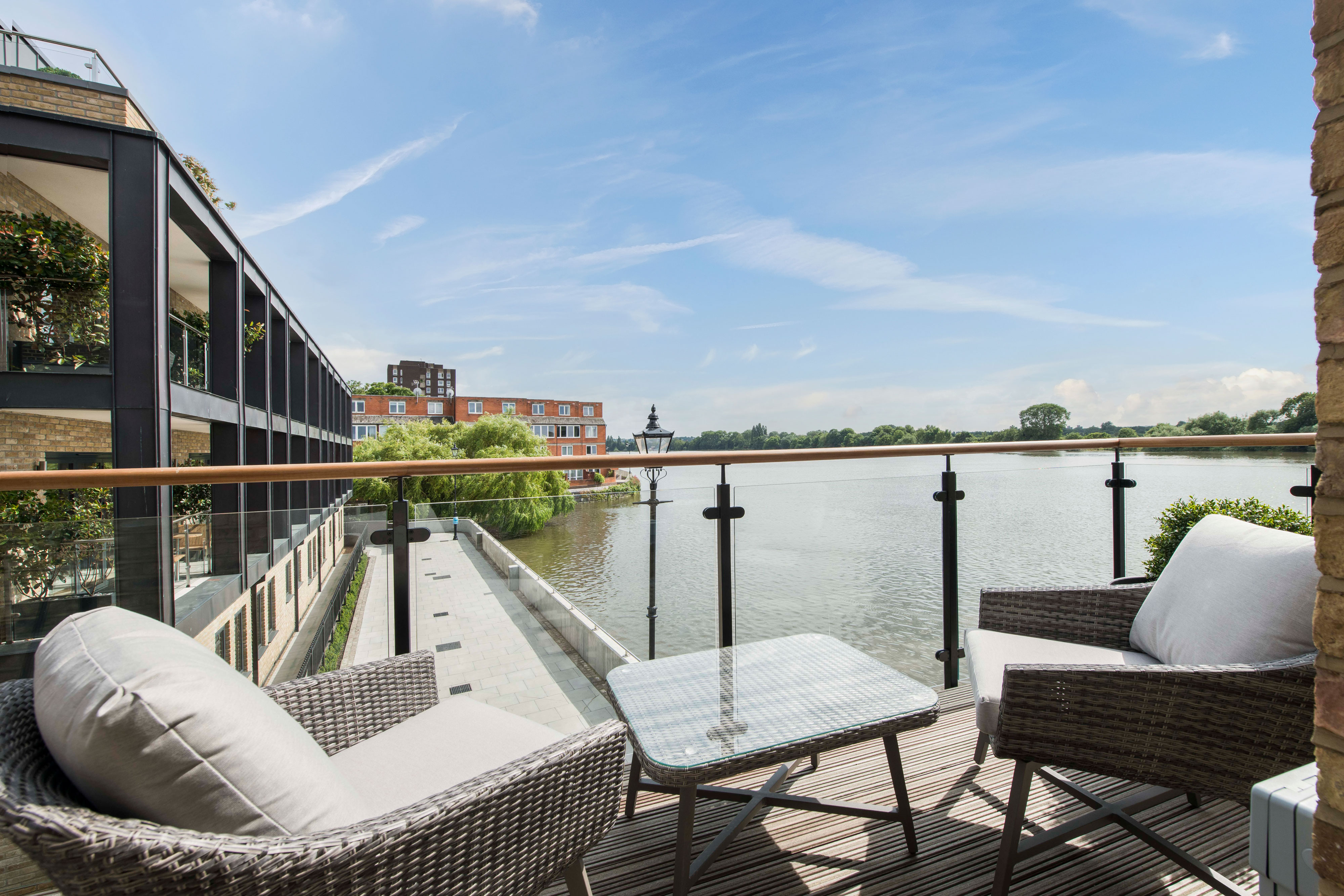 a modern balcony with beautiful waterfront views